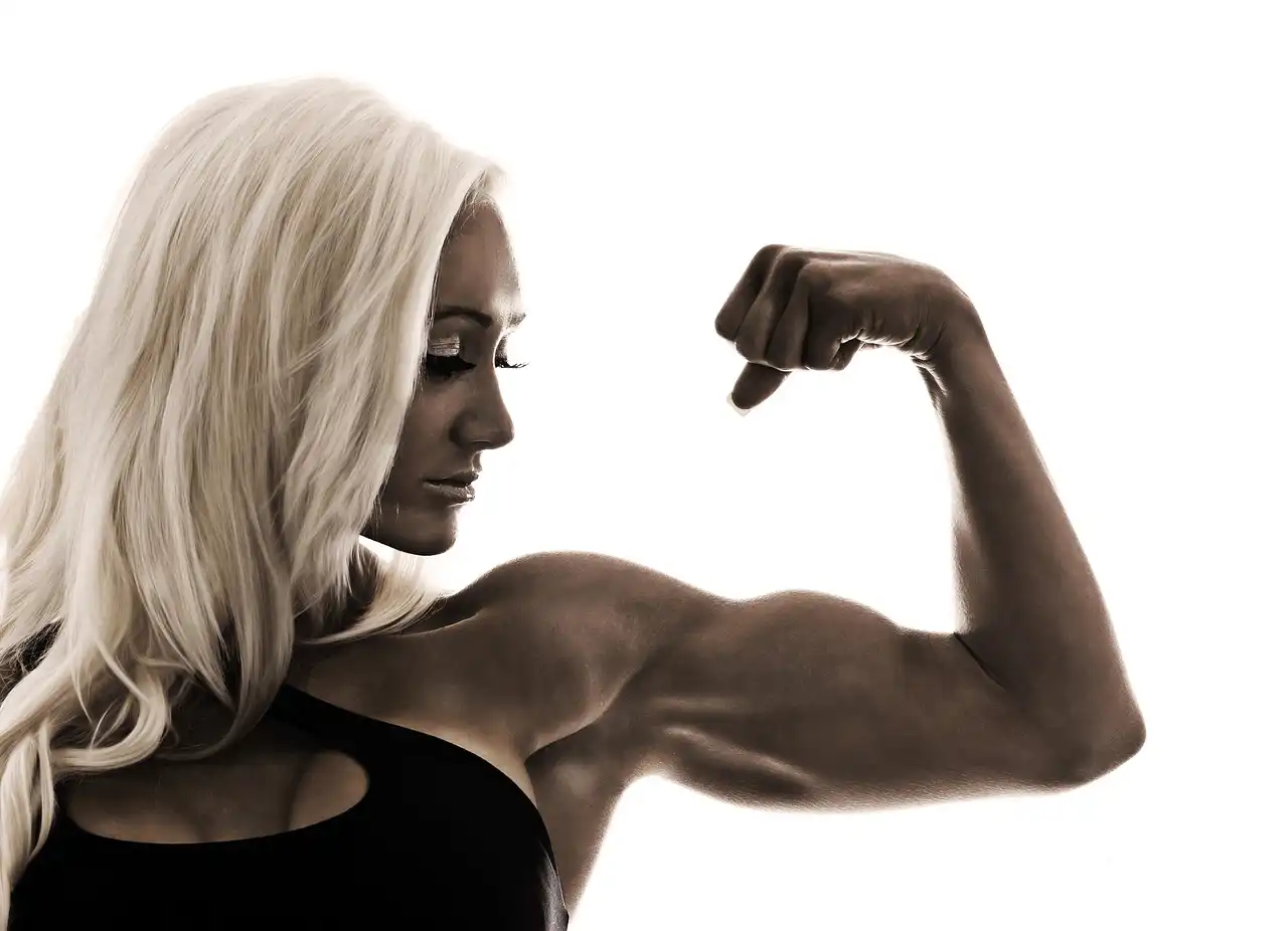 A female bodybuilder showing her muscles