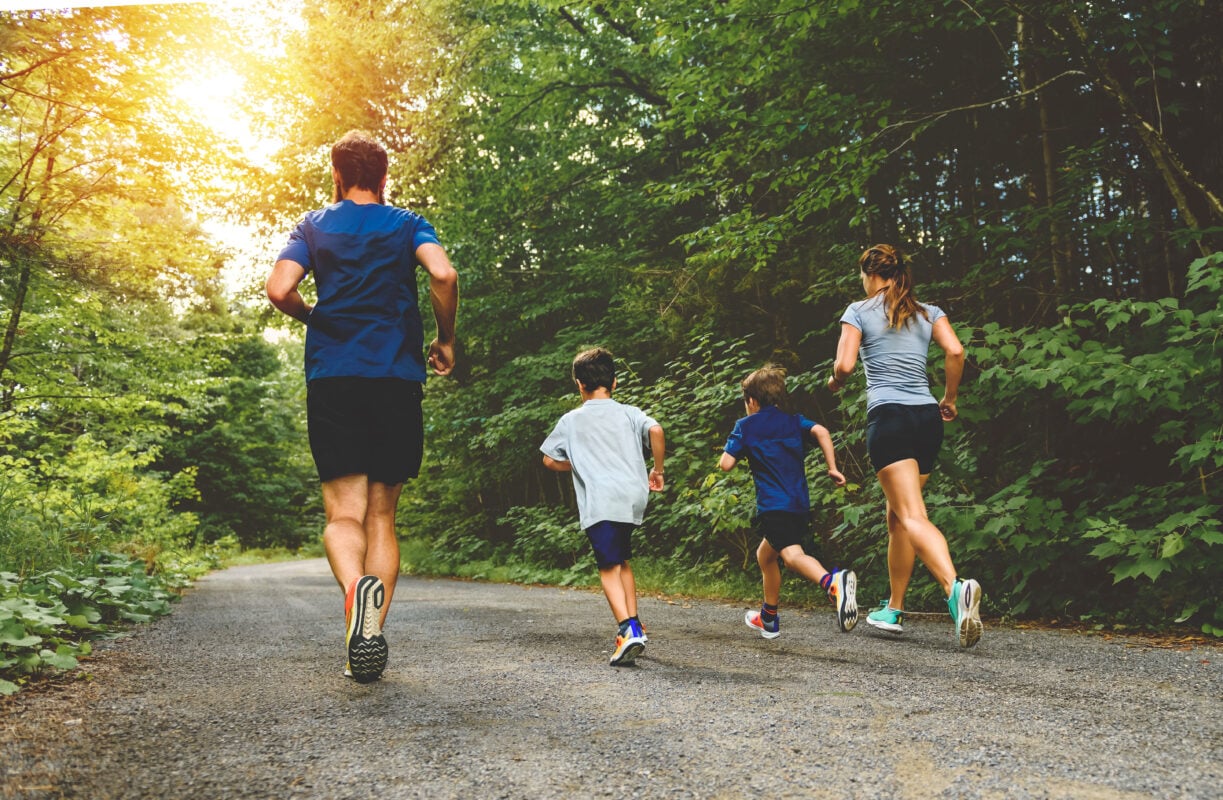 A family exercising together in the park